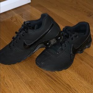 All black Nike Shox sneakers